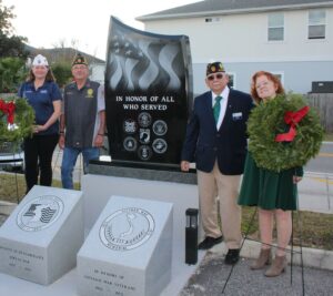 Pictured from left, American Legion Department of Florida Commander Jessica Moore, Ocean Beaches Post 129 Commander Jeff Durden, American Legion District 5 Commander Miguel Garcia and American Legion Auxiliary Unit 129 President Cindy Jordan take part in the official unveiling of monuments honoring beaches military service personnel killed in action in undeclared wars, at Ocean Beaches Post 129 in Jacksonville Beach.